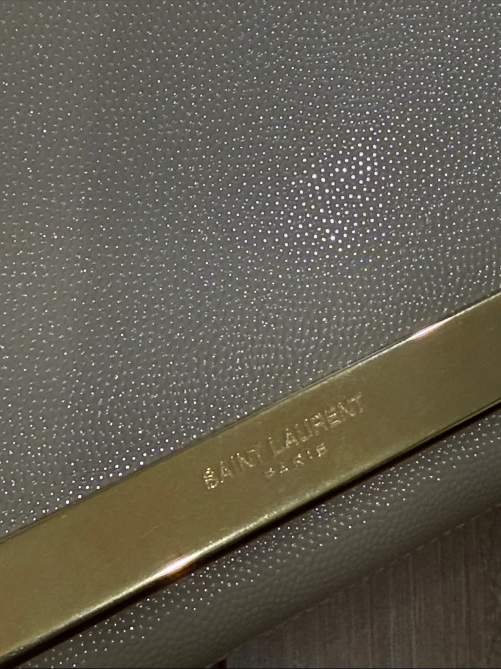 Saint Laurent Beige Leather Clutch with Gold Bar Accent